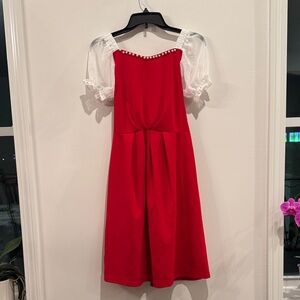 Chic Red Dress with Sheer Sleeves and Pearl Detail